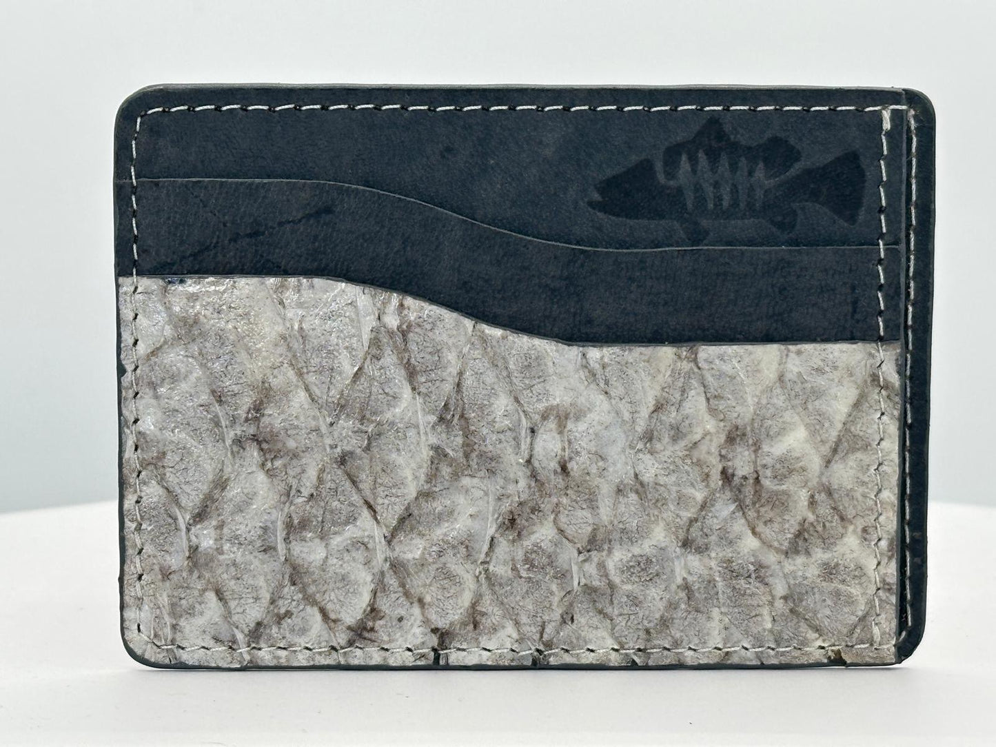 Barramundi leather card holder with grey leather card slots at top and white background - front
