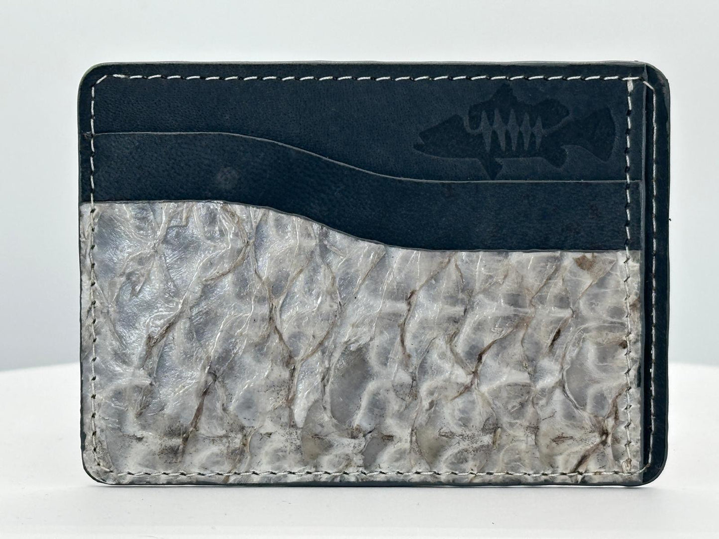 Barramundi leather card holder with grey leather card slots at top and white background - front