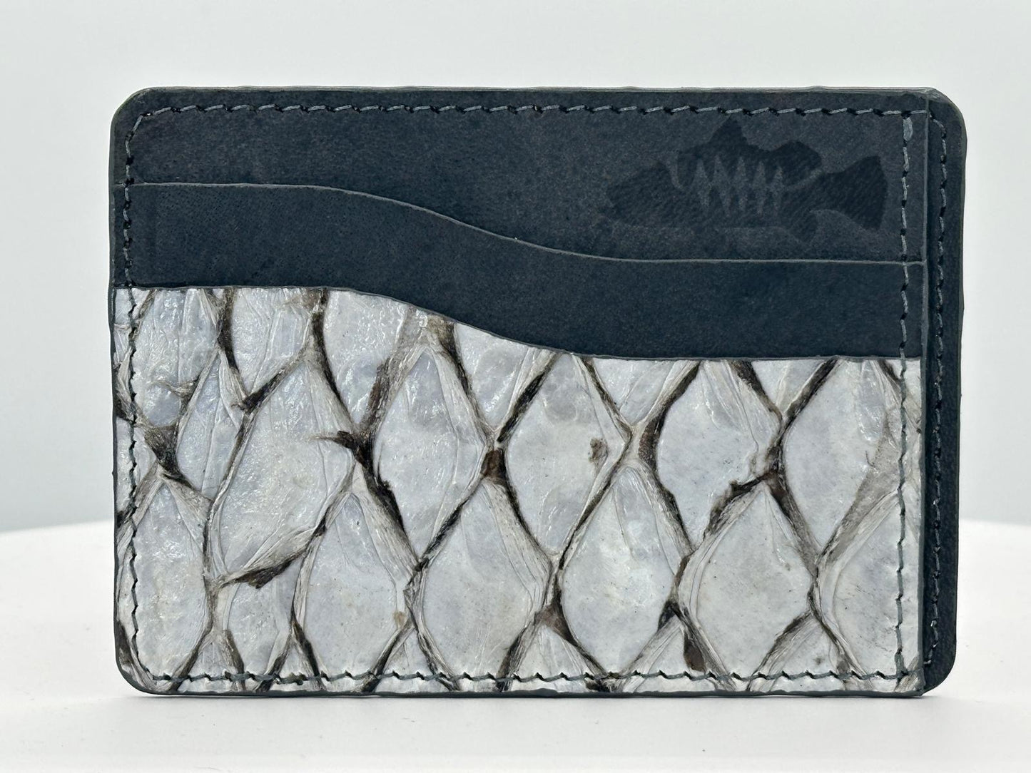 Barramundi leather card holder with grey leather card slots at top and white background - front
