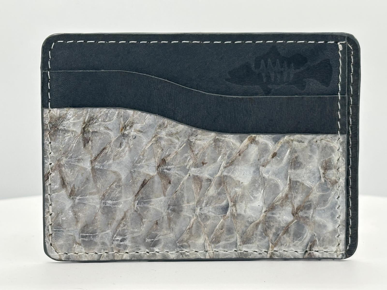 Barramundi leather card holder with grey leather card slots at top and white background - front