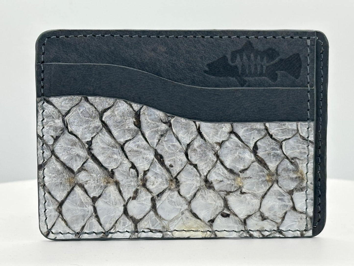 Barramundi leather card holder with grey leather card slots at top and white background - front