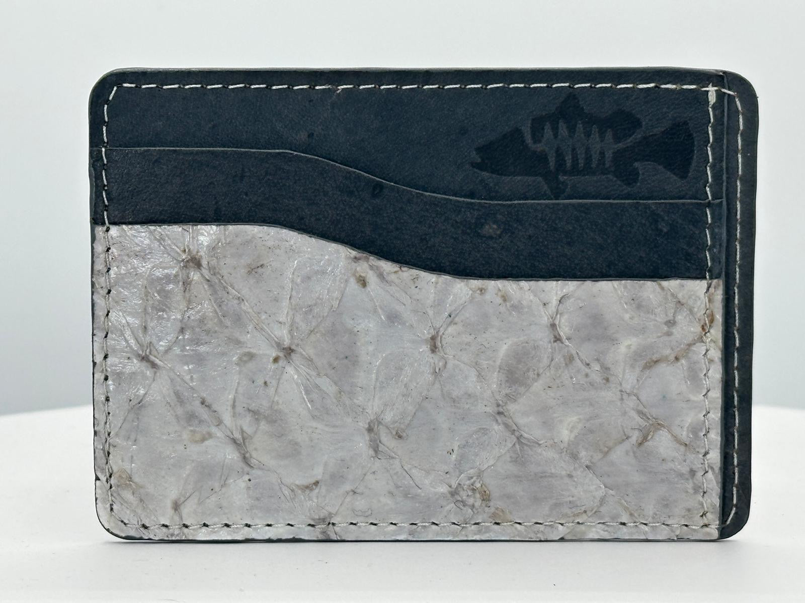 Barramundi leather card holder with grey leather card slots at top and white background - front