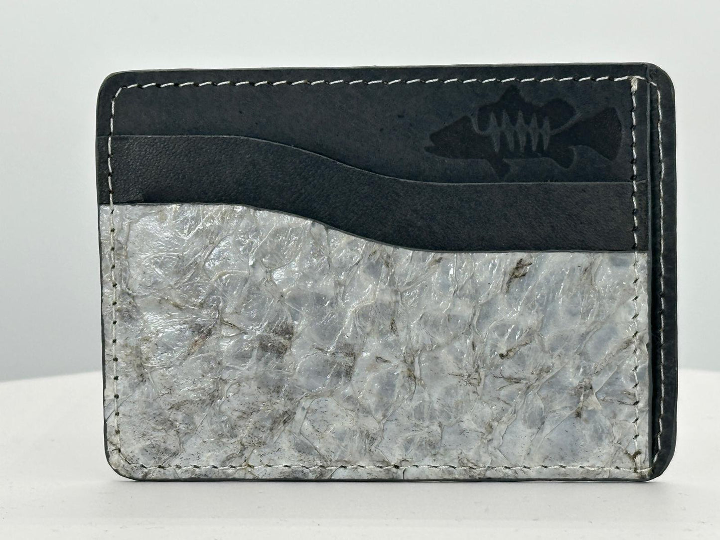 Barramundi leather card holder with grey leather card slots at top and white background - front