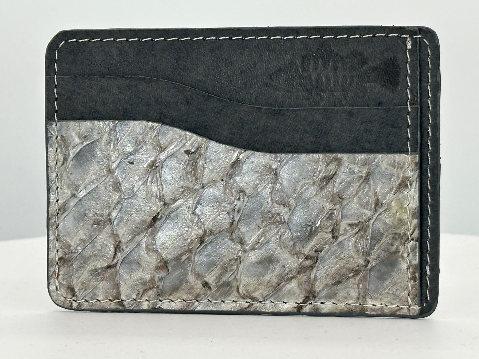 Barramundi leather card holder with grey leather card slots at top and white background - front