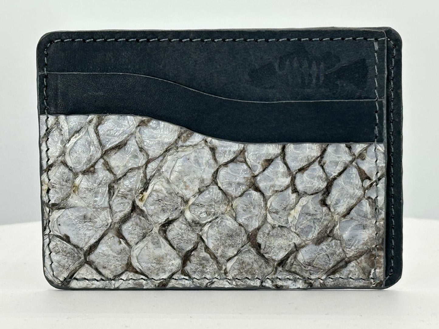 Barramundi leather card holder with grey leather card slots at top and white background - front