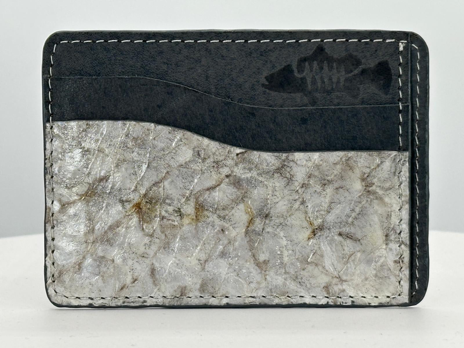 Barramundi leather card holder with grey leather card slots at top and white background - front
