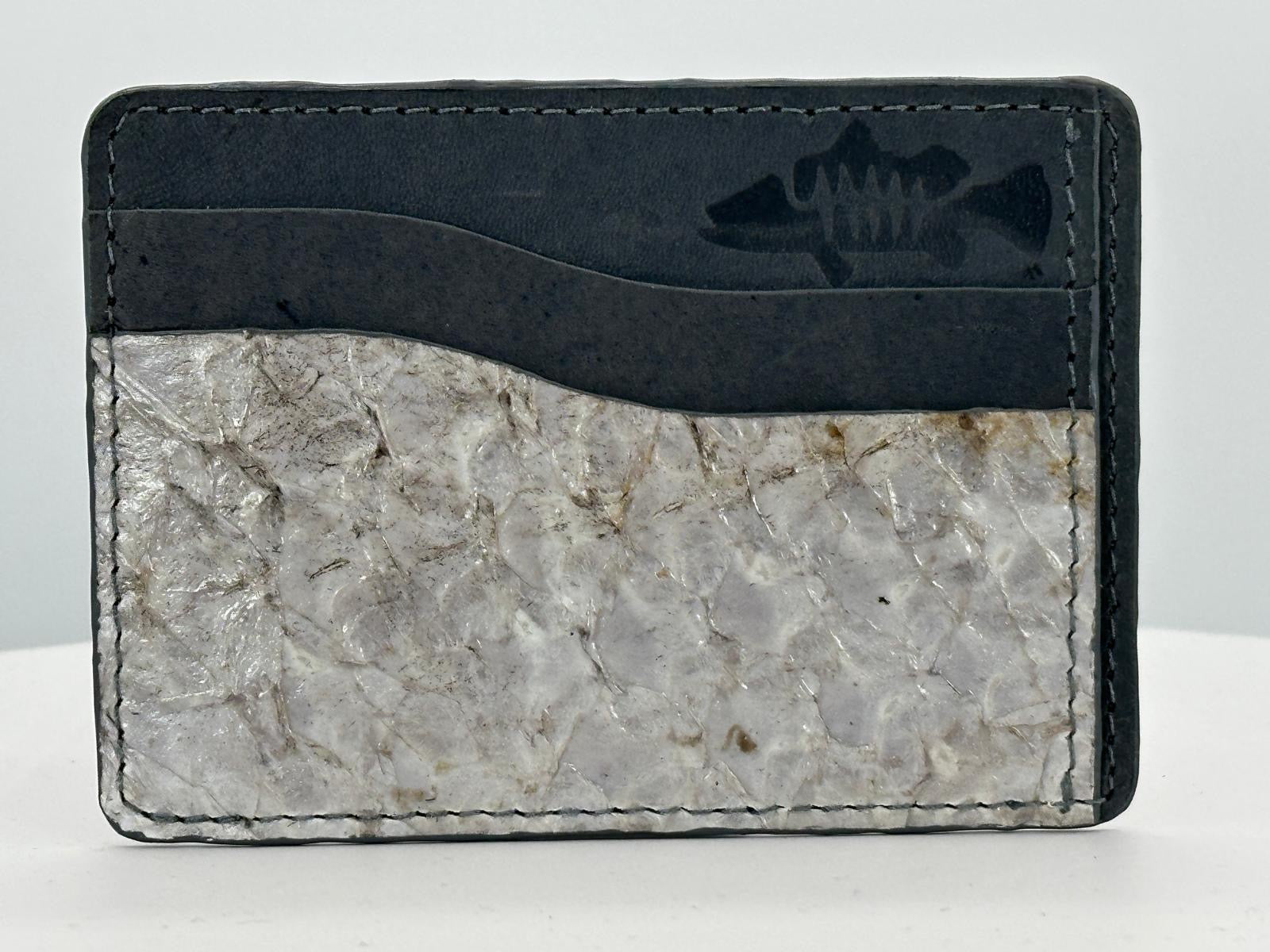 Barramundi leather card holder with grey leather card slots at top and white background - front