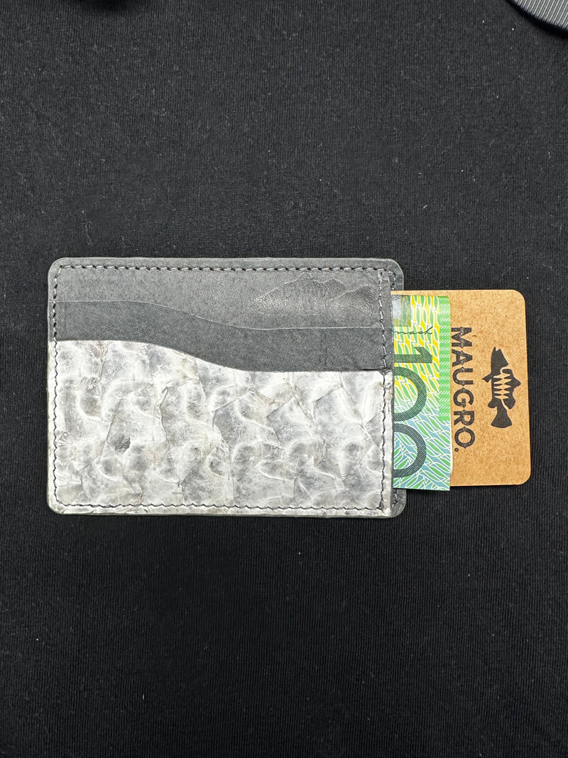 Barramundi leather card holder with textured front pocket and cards inside.