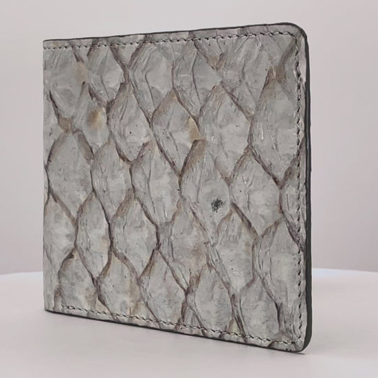 Barramundi skin wallet on a white background, denim leather interior - video