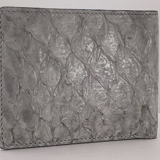 Barramundi skin wallet on a white background, denim leather interior - video
