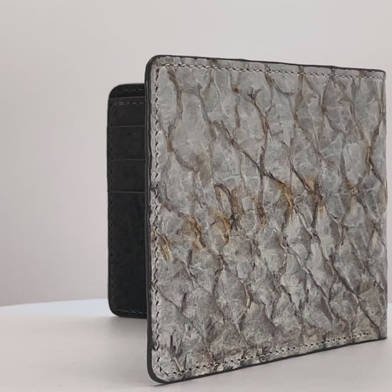 Barramundi skin wallet on a white background, denim leather interior - video