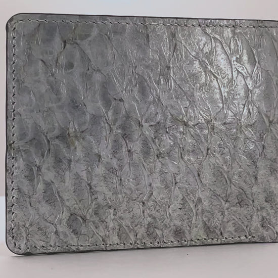 Barramundi skin wallet on a white background, denim leather interior - video