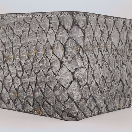 Barramundi skin wallet on a white background, denim leather interior - video
