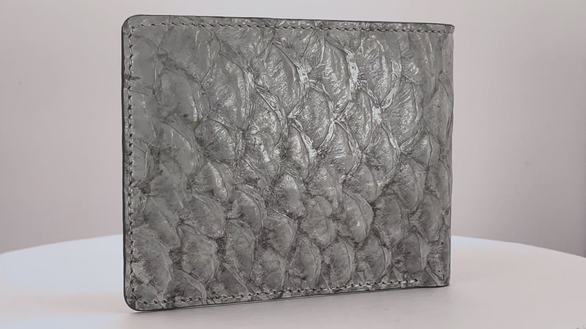 Barramundi skin wallet on a white background, denim leather interior - Video