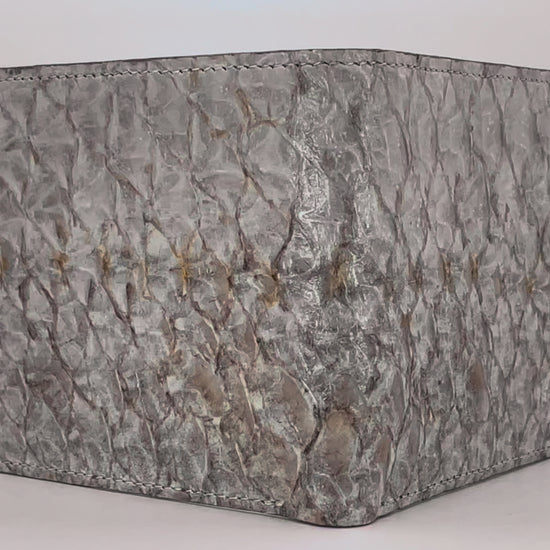 Barramundi skin wallet on a white background, denim leather interior - video