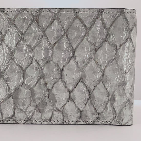 Barramundi skin wallet on a white background, denim leather interior - video