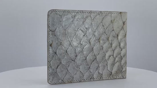 Barramundi skin wallet on a white background, brown leather interior - video