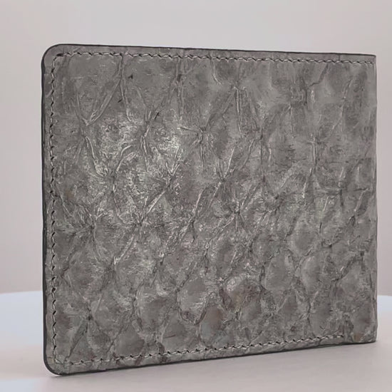 Barramundi skin wallet on a white background, denim leather interior - video