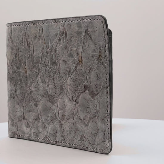 Barramundi skin wallet on a white background, denim leather interior - video