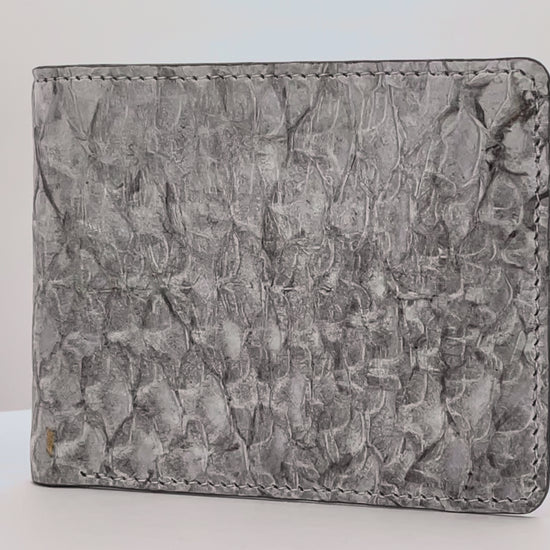 Barramundi skin wallet on a white background, denim leather interior