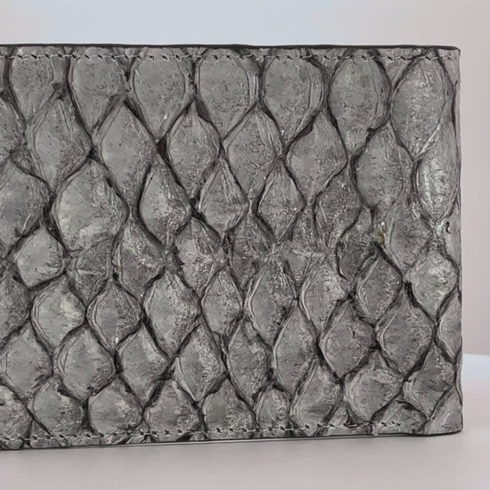Barramundi skin wallet on a white background, denim leather interior - video