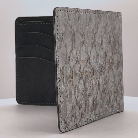Barramundi skin wallet on a white background, denim leather interior - video
