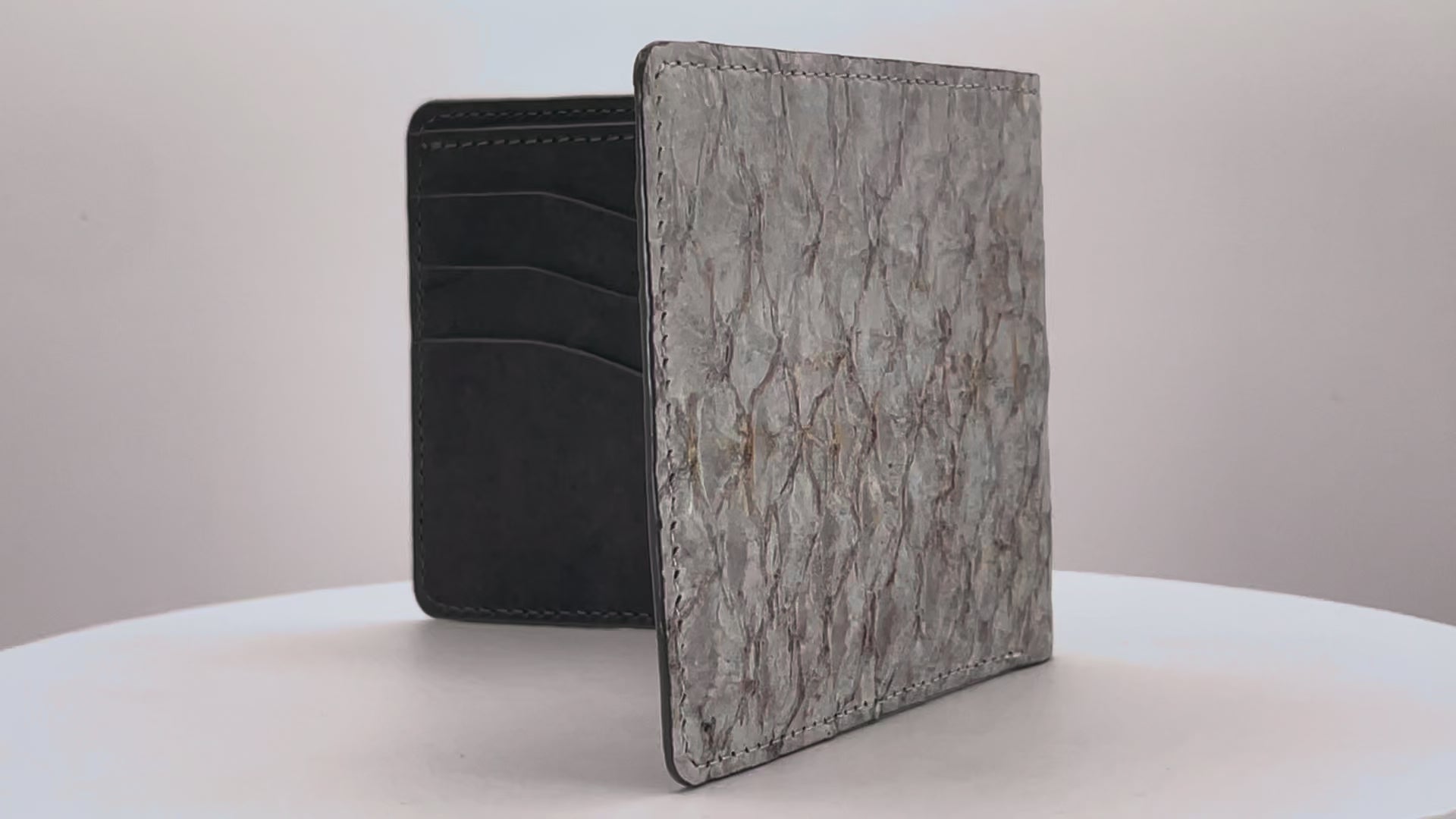Barramundi skin wallet on a white background, denim leather interior - video