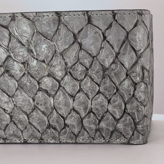 Barramundi skin wallet on a white background, denim leather interior