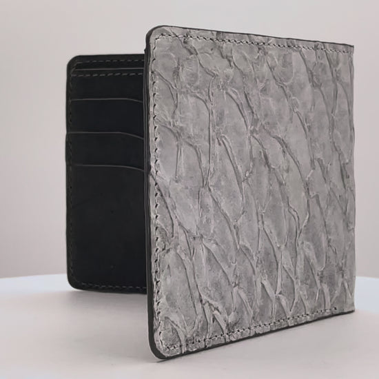 Barramundi skin wallet on a white background, denim leather interior - video