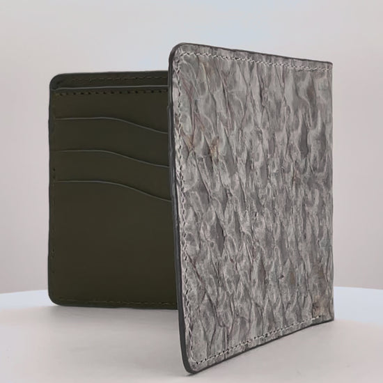 Barramundi skin wallet on a white background, green leather interior - video 