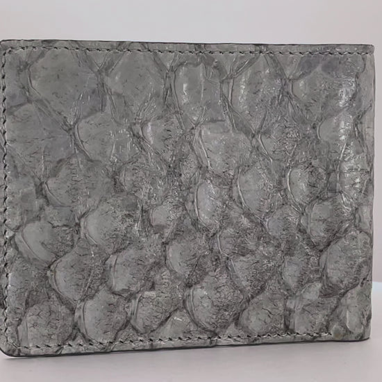 Barramundi skin wallet on a white background, denim leather interior - video